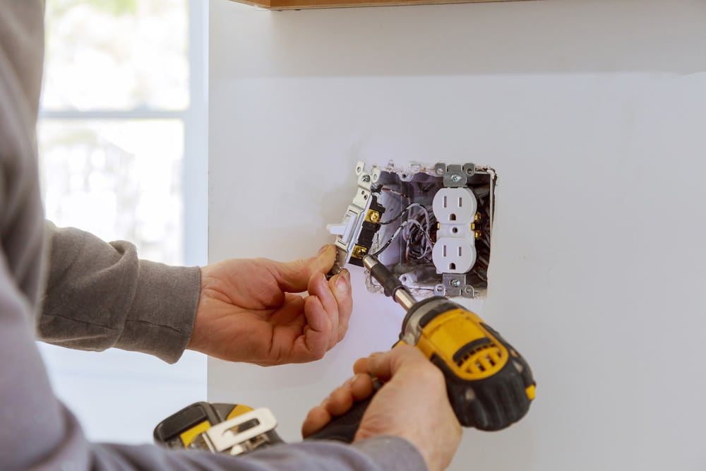 Work on installing electrical outlets with electrical wires and connector